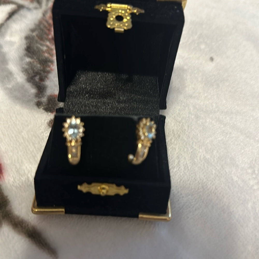 Never worn genuine, 14 karat gold, diamond and aquamarine pierced earrings.
